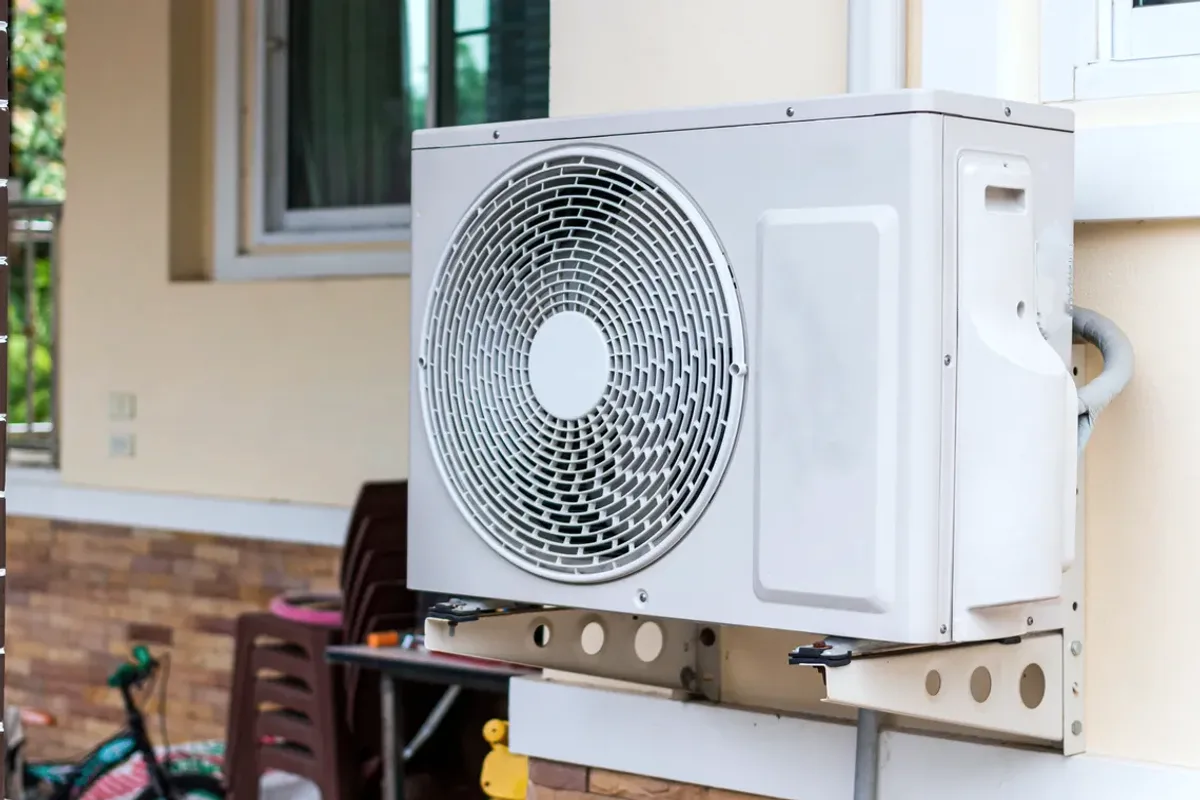 Outdoor heat pump unit on a wall bracket